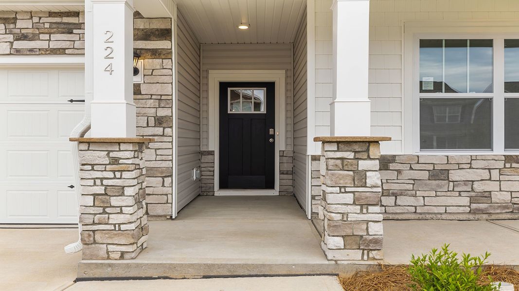 Exterior details and patio area of a home in Durbin Meadows Traditions, Fountain Inn (Image 1).