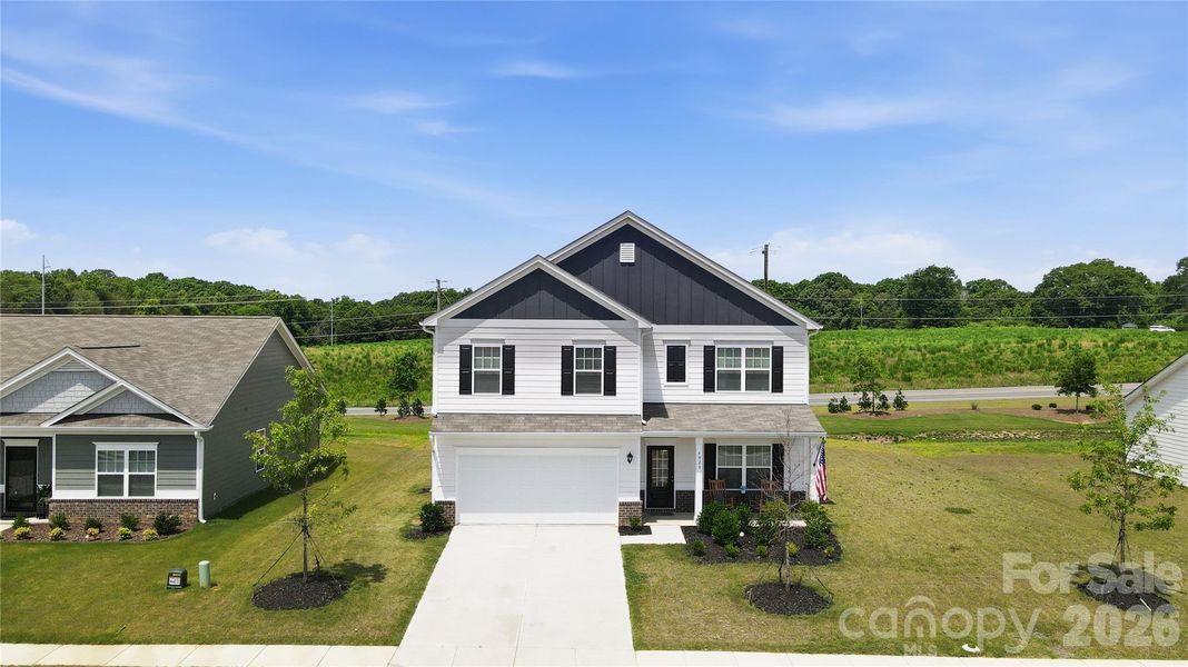 Front exterior of a new home in Pine Bluff, Midland, NC, highlighting curb appeal (Image 22).