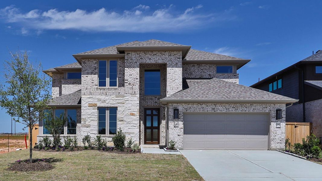 Front exterior of a new home in Everly, Tomball, TX, highlighting curb appeal (Image 2).