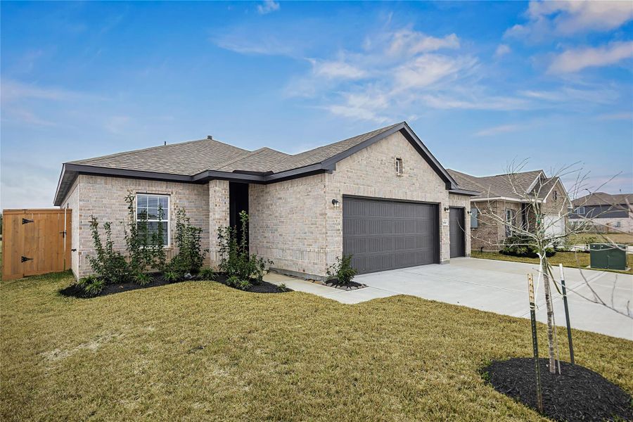 Front exterior of a new home in River Ranch Meadows, Dayton, TX, highlighting curb appeal (Image 15).