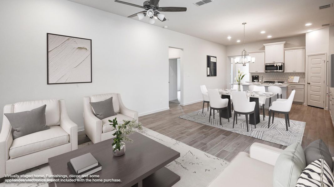 Living area with wood finish floors, a chandelier, recessed lighting, and ceiling fan