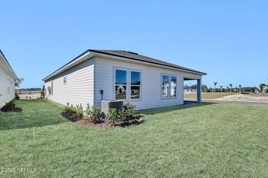 Front exterior of a new home in Reverie at Silverleaf, St. Augustine, FL, highlighting curb appeal (Image 1).