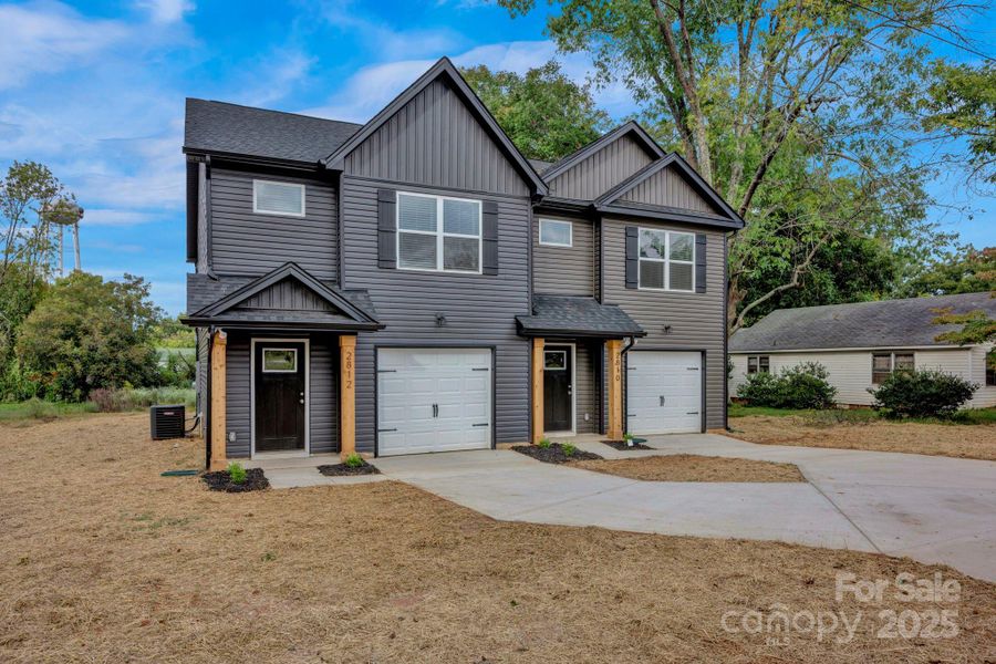 Front exterior of a new home in , Concord, NC, highlighting curb appeal (Image 20).
