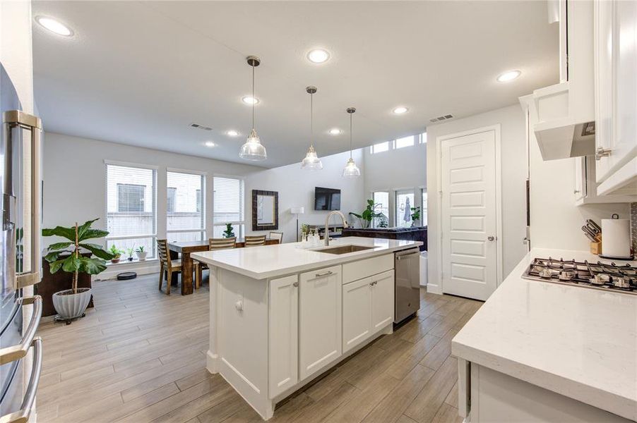 White quartz countertops framed the white cabinets in the kitchen