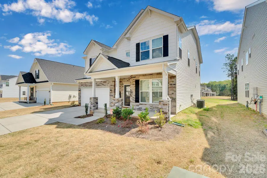 Exterior details and patio area of a home in Clairmont, Charlotte (Image 3). Exterior details and patio area of a home in Clairmont, Charlotte (Image 3).