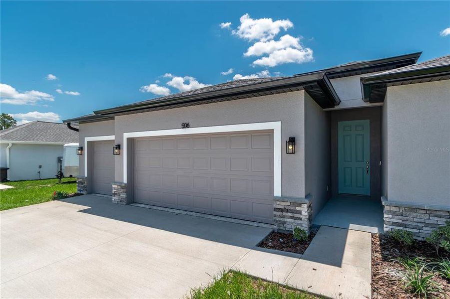 Front exterior of a new home in , Ocala, FL, highlighting curb appeal (Image 22).