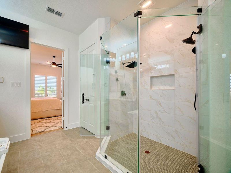 The upgraded dual shower heads & additional upgrades in the walk in shower create are your own private spa!