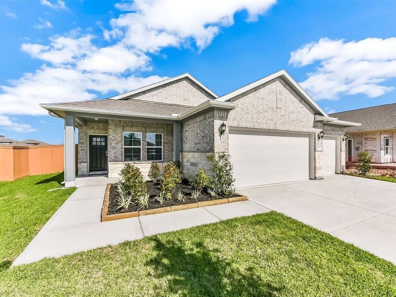 Front exterior of a new home in River Ranch Meadows, Dayton, TX, highlighting curb appeal (Image 29).