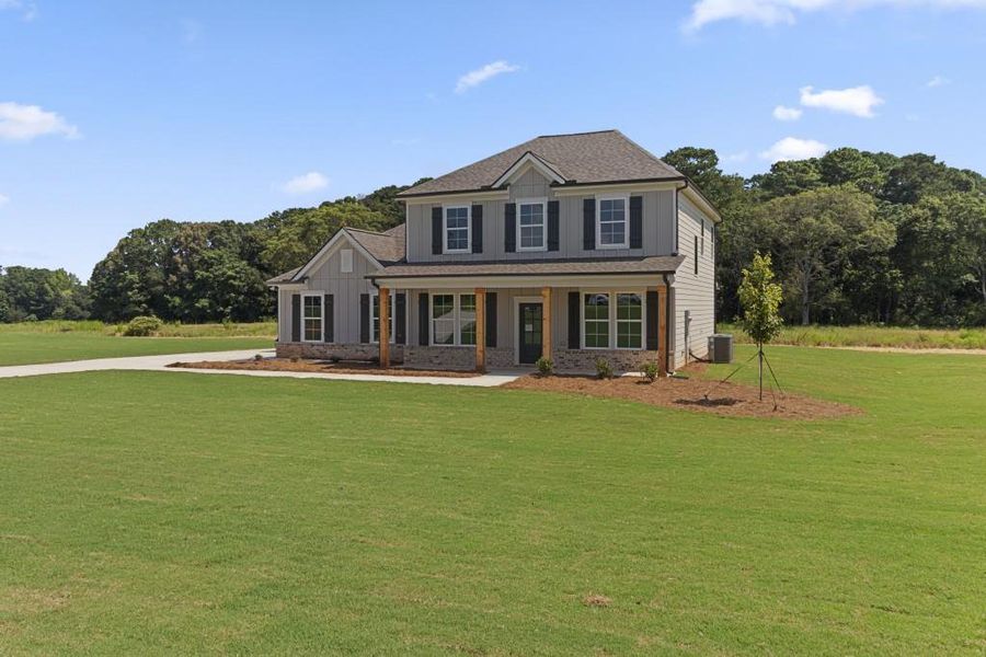 Front exterior of a new home in , Good Hope, GA, highlighting curb appeal (Image 1). Front exterior of a new home in , Good Hope, GA, highlighting curb appeal (Image 1).