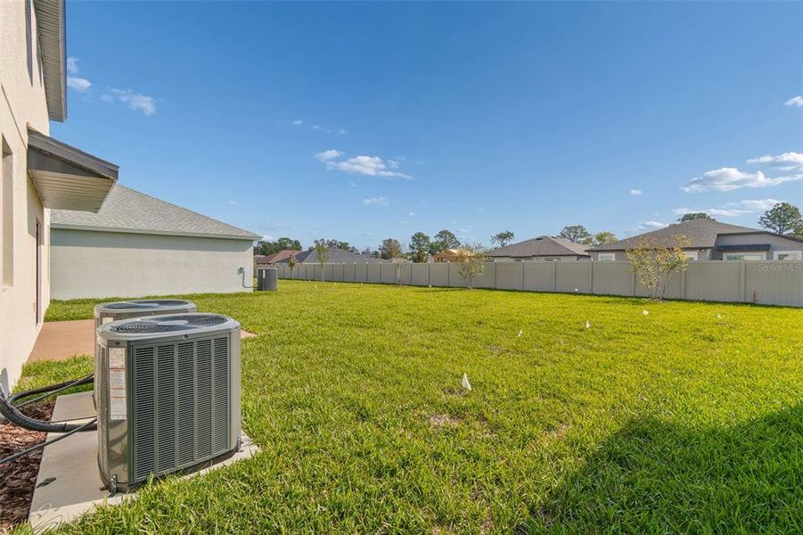 Exterior details and patio area of a home in Avalon West, Spring Hill (Image 36).