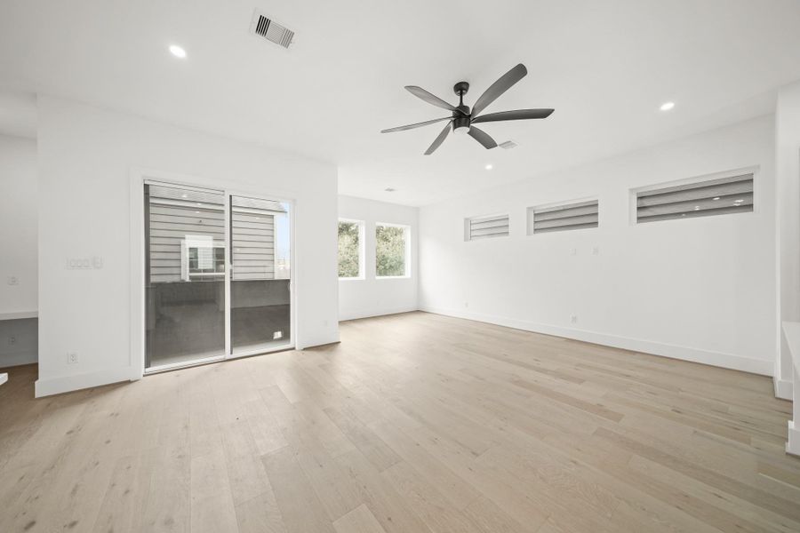 With its central location and hardwood flooring throughout, the rooms flow seamlessly from the spaciously designed family room to the formal dining room offering balcony access and sits just steps from the kitchen, half bath and staircase for added convenience.