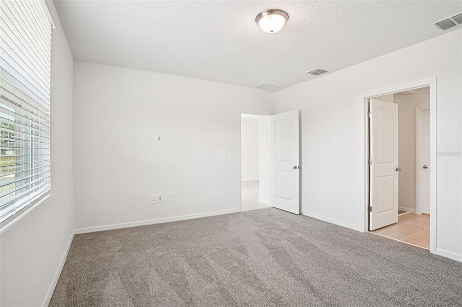 Spacious, unfurnished interior of a new home in Ridgehaven - Villas, Ormond Beach (Image 15).