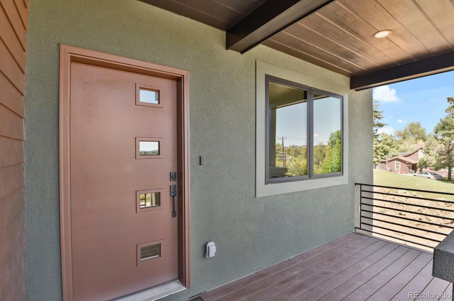 Welcoming front porch with custom fabricated metal railing and Trex Transcend decking Welcoming front porch with custom fabricated metal railing and Trex Transcend decking