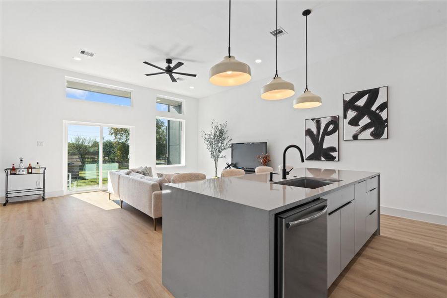 A rare 11-ft ceiling height shapes the main living area, enhancing scale, light, & the connection to the covered balcony beyond. A rare 11-ft ceiling height shapes the main living area, enhancing scale, light, & the connection to the covered balcony beyond.