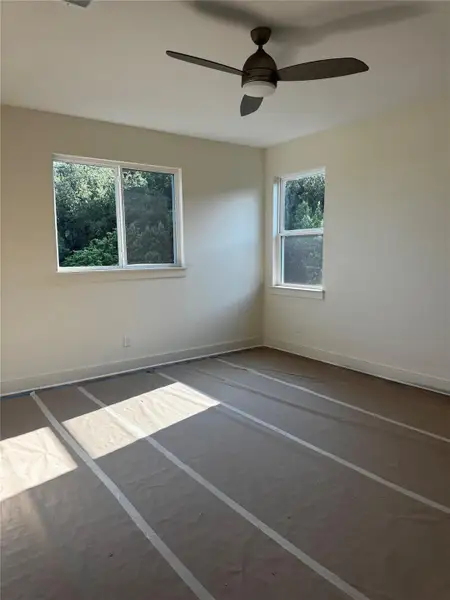 Unfurnished room with baseboards and ceiling fan Unfurnished room with baseboards and ceiling fan