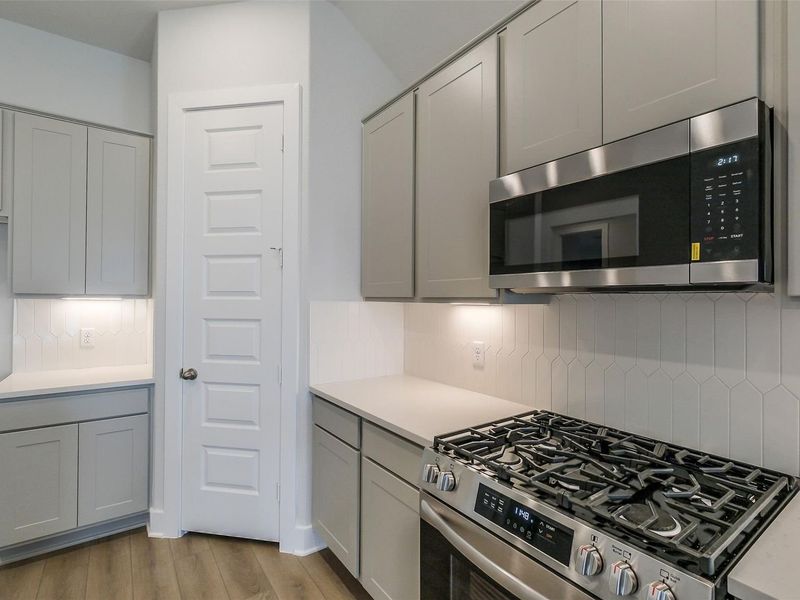 Furnished interior view inside a new home in Sunterra, Katy (Image 11).