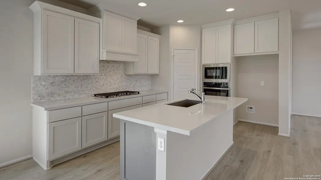 Furnished interior view inside a new home in Ladera 40', San Antonio (Image 11).