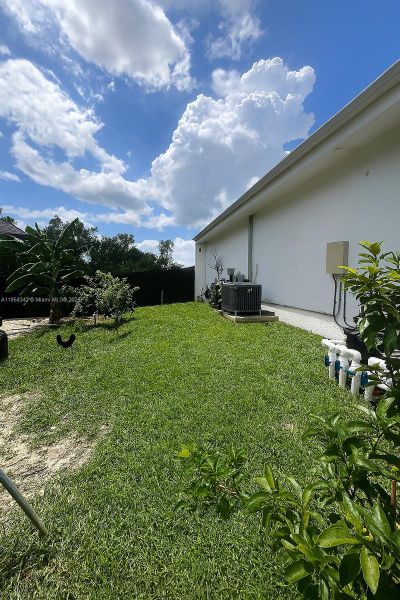 Front exterior of a new home in , Lehigh Acres, FL, highlighting curb appeal (Image 20). Front exterior of a new home in , Lehigh Acres, FL, highlighting curb appeal (Image 20).