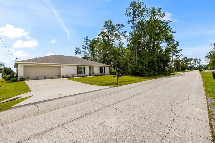 Front exterior of a new home in Palm Coast, Palm Coast, FL, highlighting curb appeal (Image 24). Front exterior of a new home in Palm Coast, Palm Coast, FL, highlighting curb appeal (Image 24).