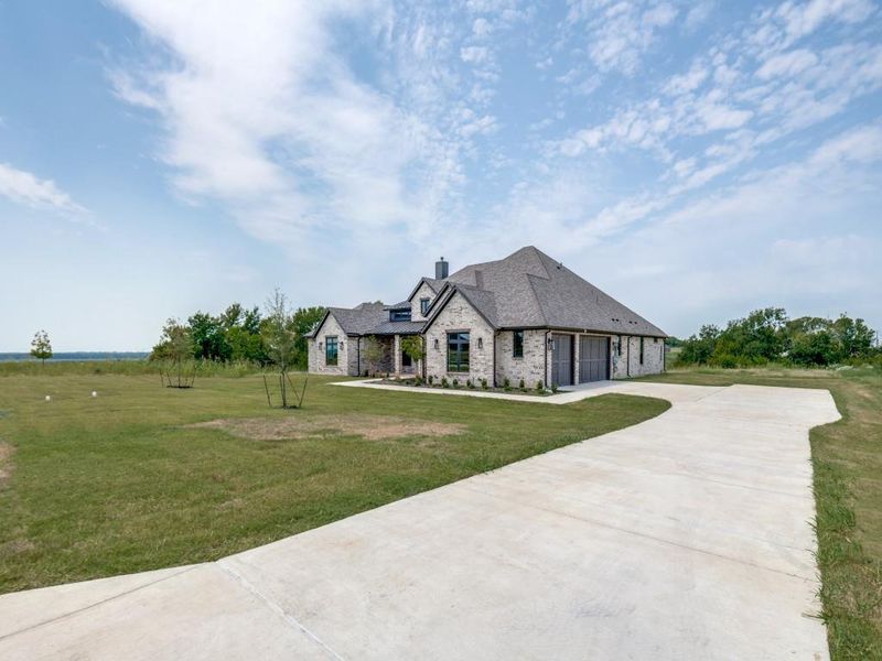 Front exterior of a new home in , Mesquite, TX, highlighting curb appeal (Image 2).
