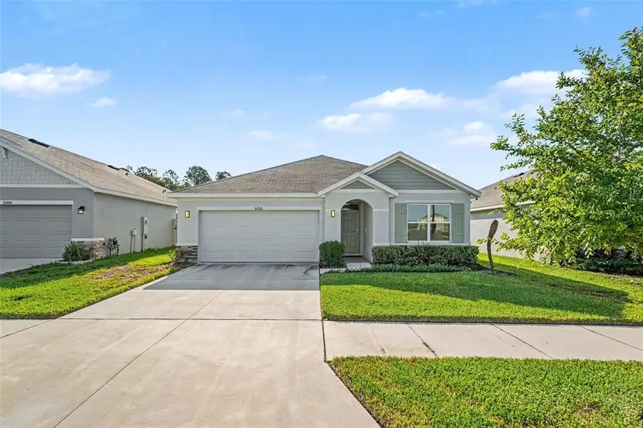 Front exterior of a new home in Mirada, San Antonio, FL, highlighting curb appeal (Image 2). Front exterior of a new home in Mirada, San Antonio, FL, highlighting curb appeal (Image 2).
