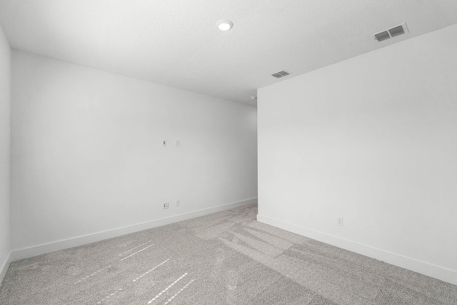 Representative unfurnished interior of a home built from the Newton by Rockwell Homes in Harvest at Ovation - Townhomes, Winter Garden (Image 54). Representative unfurnished interior of a home built from the Newton by Rockwell Homes in Harvest at Ovation - Townhomes, Winter Garden (Image 54).