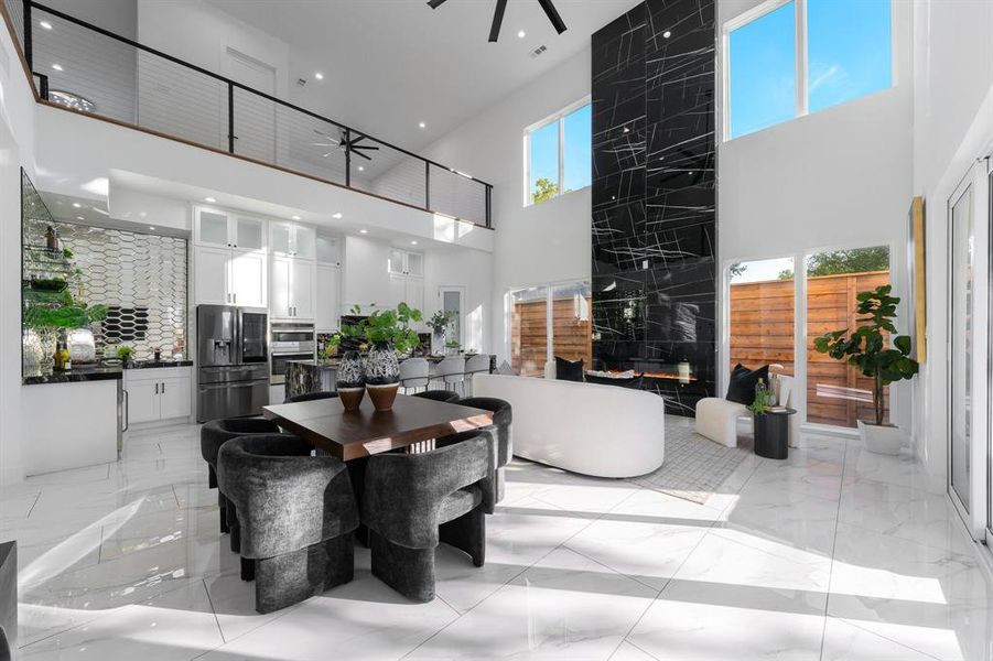 View from dining area up to the second level open game room. View from dining area up to the second level open game room.