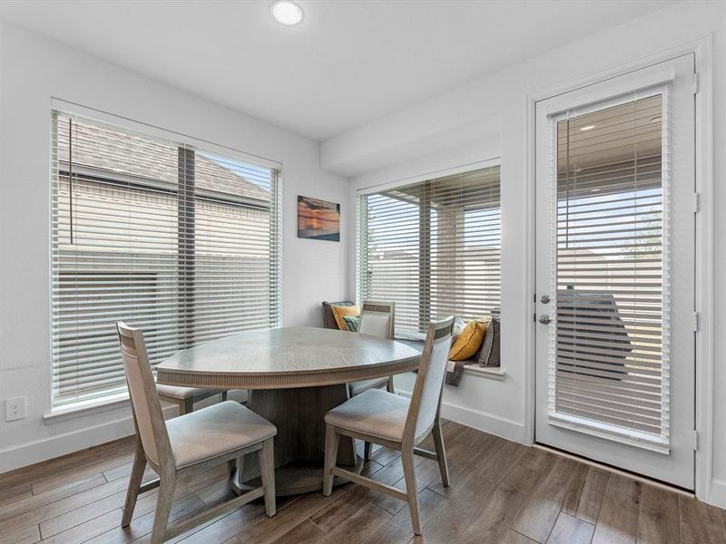 Adjacent breakfast dining area w/ a cozy window ledge