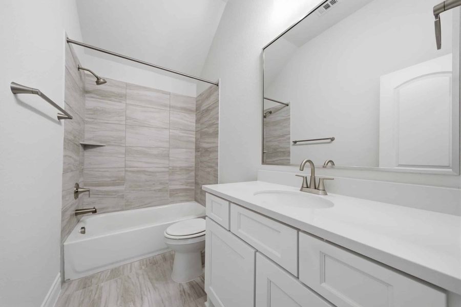Furnished interior view inside a new home in The Woodlands Hills 65′, Willis (Image 30).