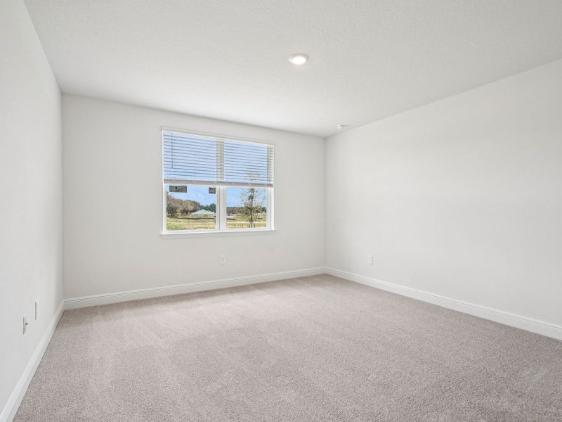 Spacious, unfurnished interior of a new home in The Reserve at Hammock Oaks - Signature Series, Lady Lake (Image 13).