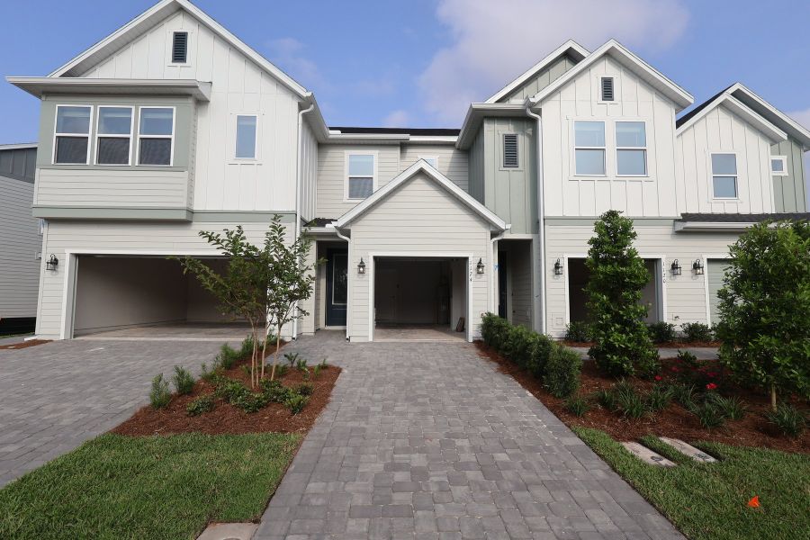 Front exterior of a new home in Preserve at The Cays – The Driftwood Series, Daytona Beach, FL, highlighting curb appeal (Image 2). Front exterior of a new home in Preserve at The Cays – The Driftwood Series, Daytona Beach, FL, highlighting curb appeal (Image 2).