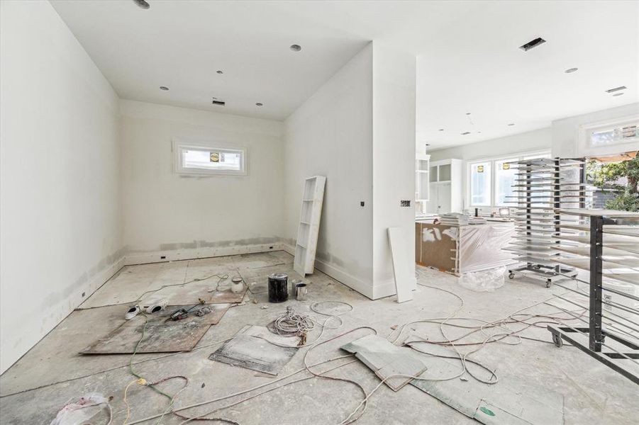 This dining room has a wonderful dedicated space while still open and convenient to the kitchen and wet-bar area.  Stunning, designer light fixture coming soon.  Construction as of 10/29