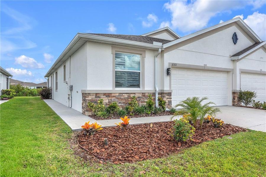 Front exterior of a new home in , Wesley Chapel, FL, highlighting curb appeal (Image 1). Front exterior of a new home in , Wesley Chapel, FL, highlighting curb appeal (Image 1).