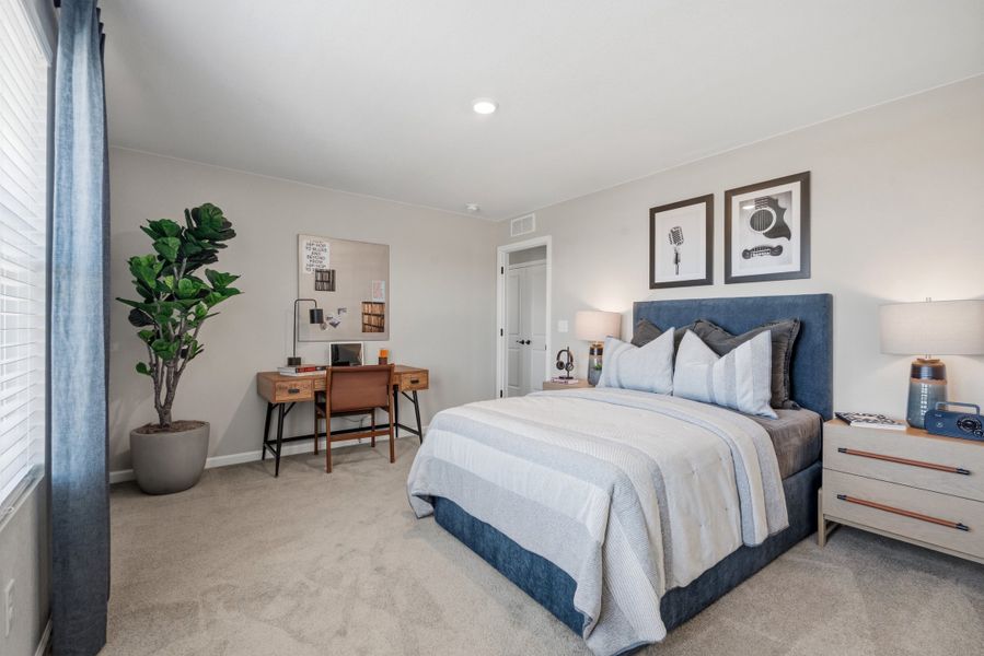 Representative furnished interior of a home built from the 4008 by Risewell Homes in Harvest Crossing, Aurora (Image 18).