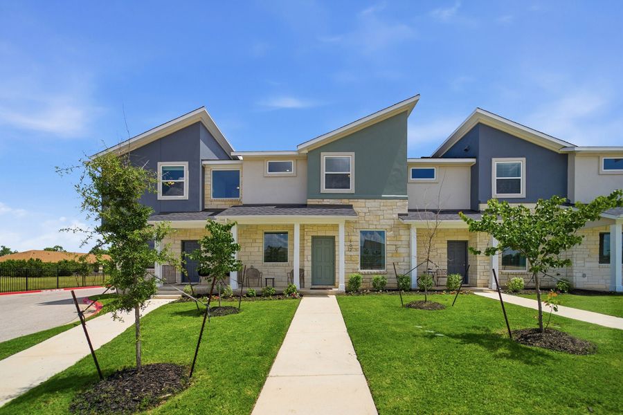 Representative exterior photo of a completed home built from the Mies by CastleRock Communities in Municipal Drive Townhomes, Leander, TX (Image 1). Representative exterior photo of a completed home built from the Mies by CastleRock Communities in Municipal Drive Townhomes, Leander, TX (Image 1).