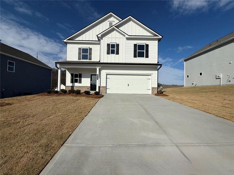 Front exterior of a new home in The Stiles, Cartersville, GA, highlighting curb appeal (Image 1). Front exterior of a new home in The Stiles, Cartersville, GA, highlighting curb appeal (Image 1).