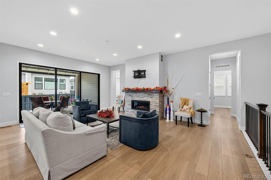 Living Room (Angle 3) – Seamless indoor-outdoor living with sliding glass doors leading to the covered patio, ideal for year-round enjoyment.