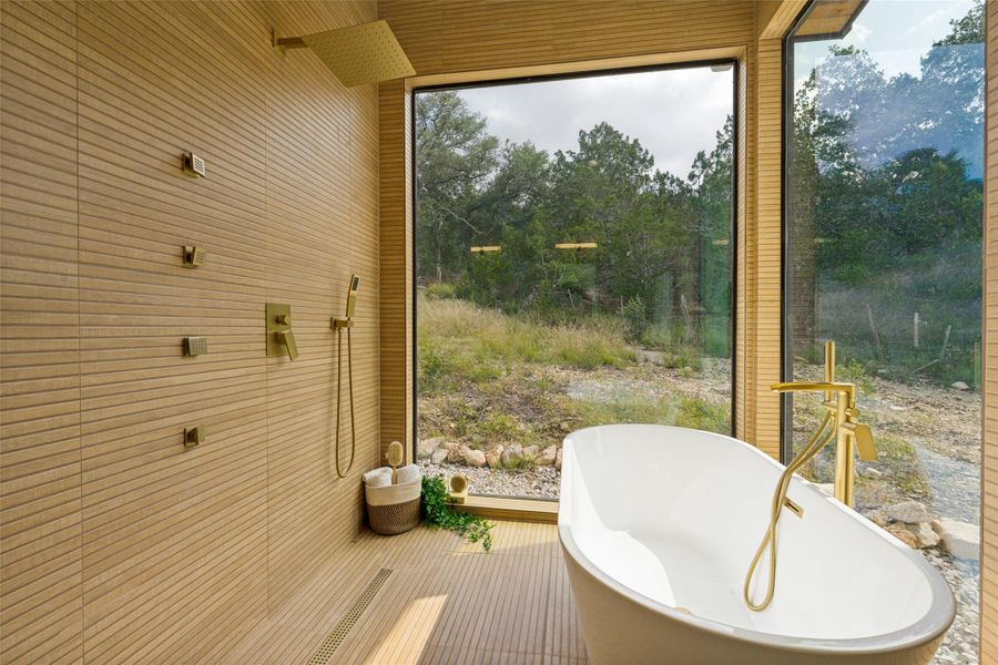 Exposed wood beams and modern floor-to-ceiling windows create an airy, tranquil retreat.
