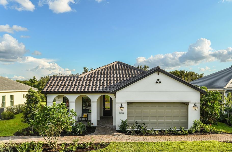 Representative exterior photo of a completed home built from the Starlight by Neal Communities in Verandah, Fort Myers, FL (Image 1). Representative exterior photo of a completed home built from the Starlight by Neal Communities in Verandah, Fort Myers, FL (Image 1).