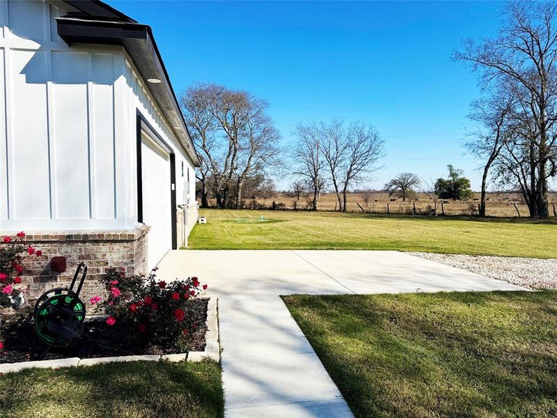 View of green lawn with a view of countryside