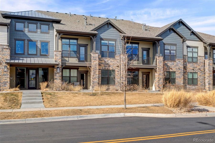 Front exterior of a new home in , Longmont, CO, highlighting curb appeal (Image 17).