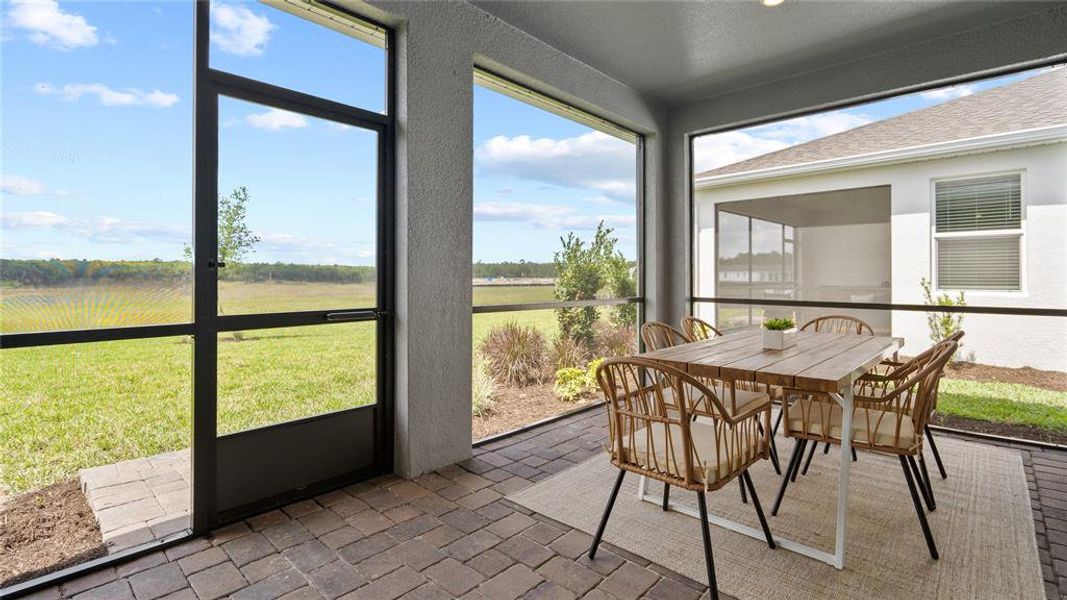 Sunroom / solarium with brick floors, plenty of natural light, and outdoor dining space Sunroom / solarium with brick floors, plenty of natural light, and outdoor dining space