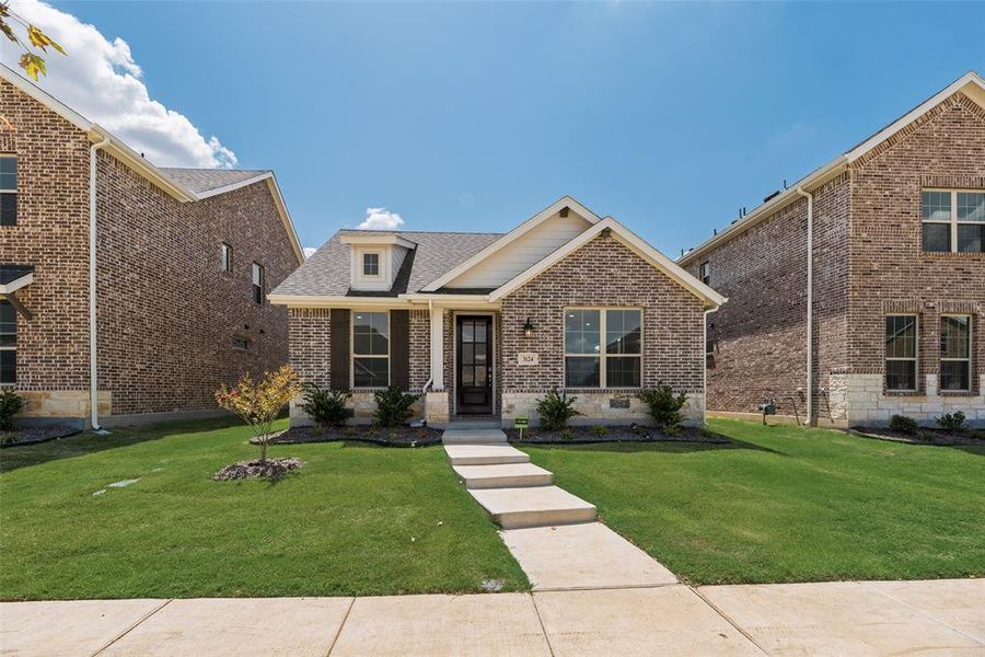 Front exterior of a new home in Arbors at Legacy Hills, Celina, TX, highlighting curb appeal (Image 19).