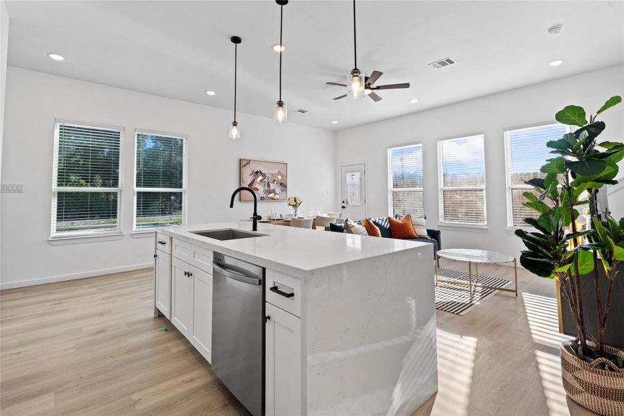 From the kitchen, you can see the entire living area — an open design that keeps everyone connected. From the kitchen, you can see the entire living area — an open design that keeps everyone connected.