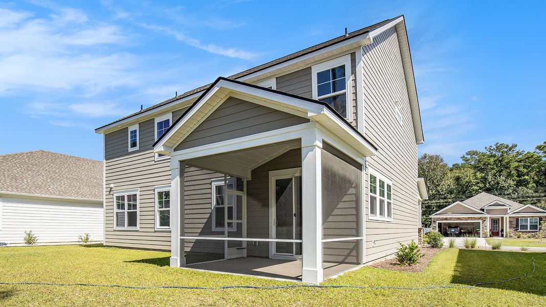 Exterior details and patio area of a home in Heron Pointe, Myrtle Beach (Image 4).