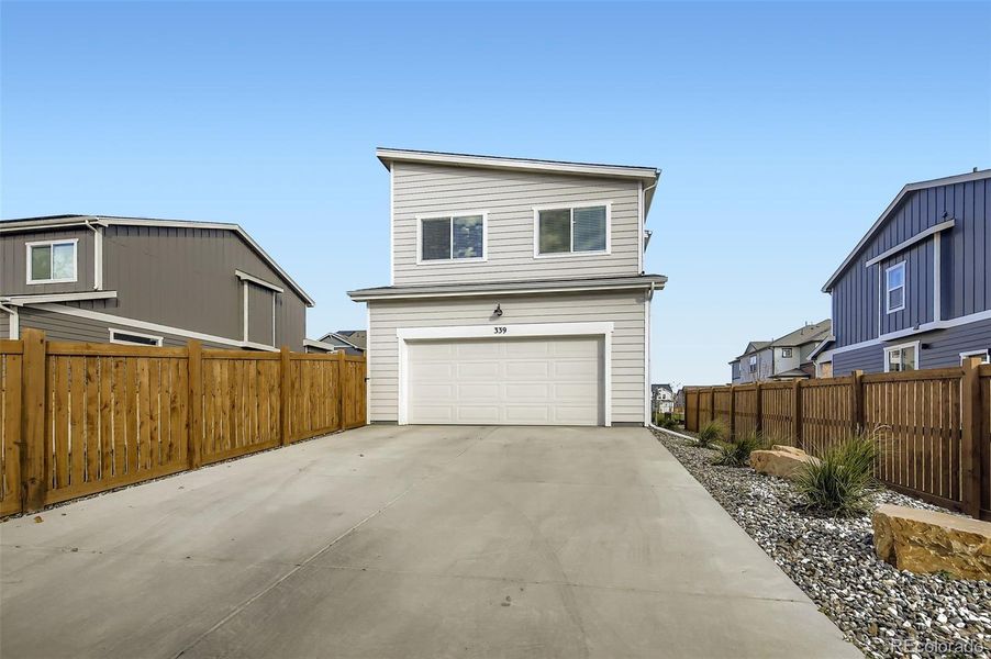 Front exterior of a new home in Fickel Farm, Berthoud, CO, highlighting curb appeal (Image 26).