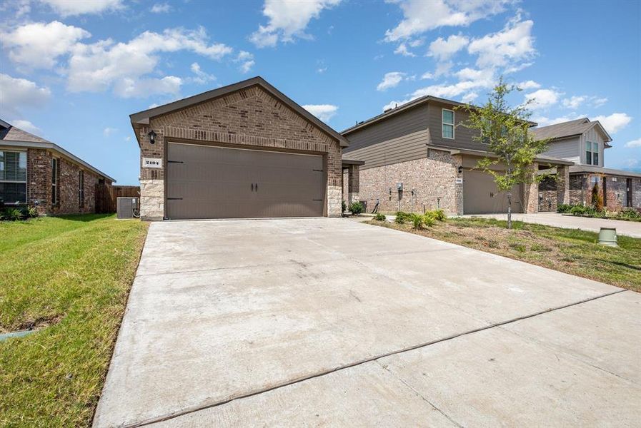 Front exterior of a new home in , Royse City, TX, highlighting curb appeal (Image 16). Front exterior of a new home in , Royse City, TX, highlighting curb appeal (Image 16).
