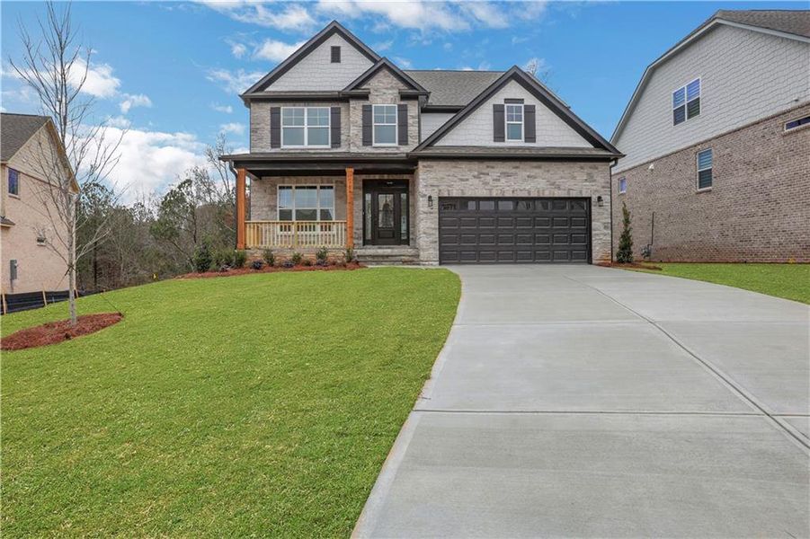 Front exterior of a new home in Cambridge, Flowery Branch, GA, highlighting curb appeal (Image 2). Front exterior of a new home in Cambridge, Flowery Branch, GA, highlighting curb appeal (Image 2).