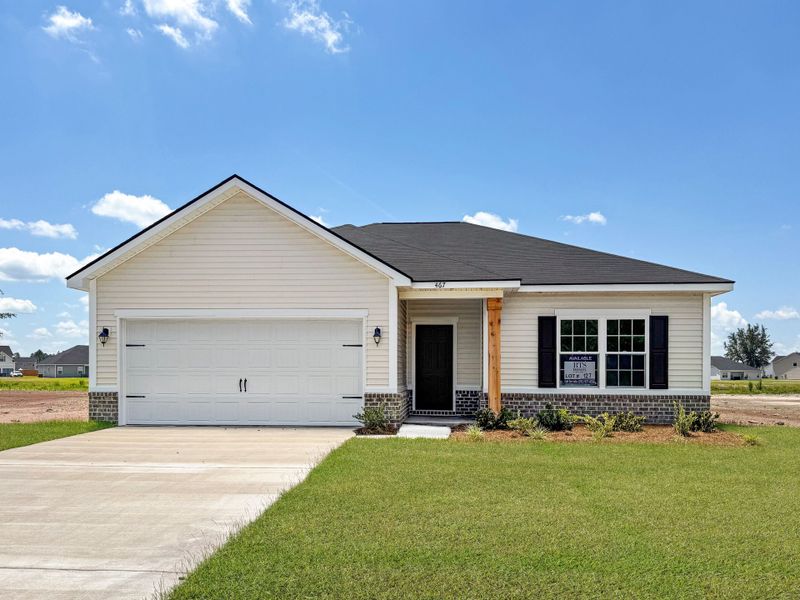 Front exterior of a new home in The Village at Sassafras, Allenhurst, GA, highlighting curb appeal (Image 1). Front exterior of a new home in The Village at Sassafras, Allenhurst, GA, highlighting curb appeal (Image 1).