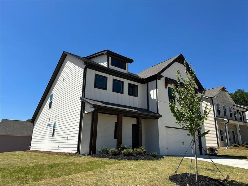 Front exterior of a new home in Summerlin, Winder, GA, highlighting curb appeal (Image 25).
